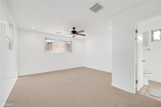 carpeted empty room with ceiling fan