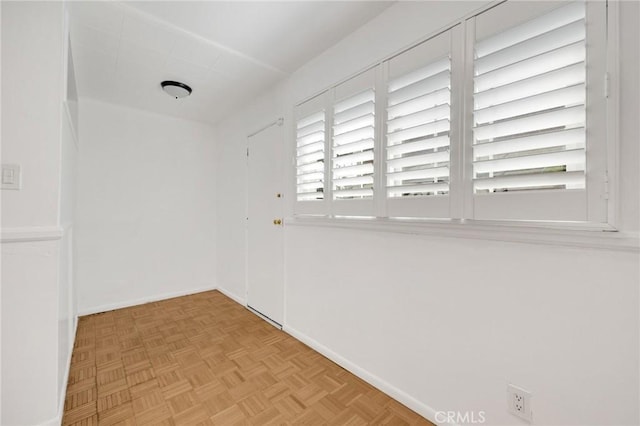 unfurnished room featuring light parquet floors