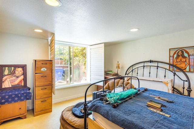 carpeted bedroom with a textured ceiling