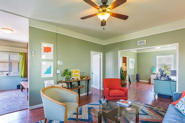 living room featuring dark hardwood / wood-style floors and ceiling fan