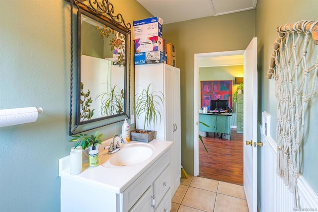 bathroom featuring hardwood / wood-style flooring and vanity