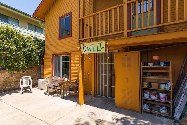 entrance to property with a patio