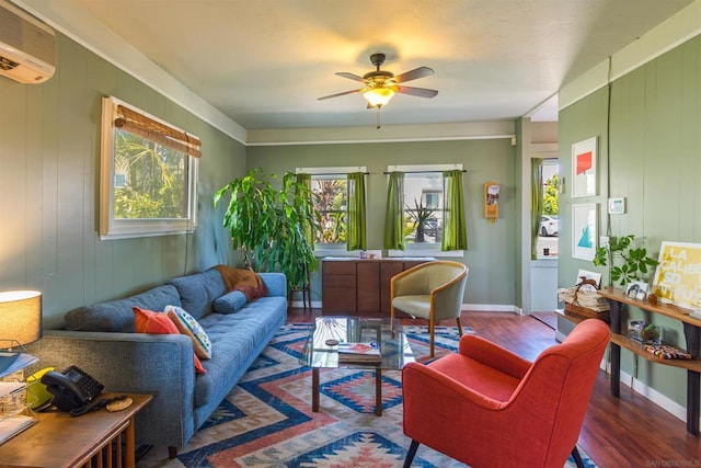 living room featuring ceiling fan, an AC wall unit, dark wood-type flooring, and wooden walls