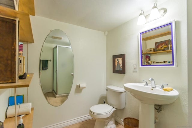 bathroom featuring tile patterned flooring and toilet