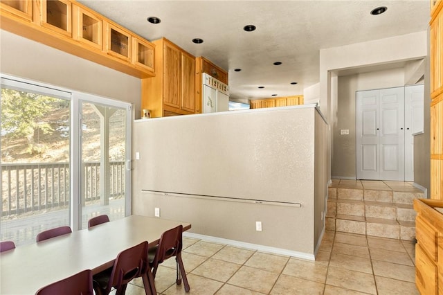 kitchen featuring light tile patterned flooring