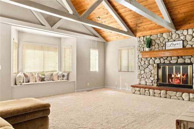 carpeted living room featuring wood ceiling, a fireplace, high vaulted ceiling, and beam ceiling