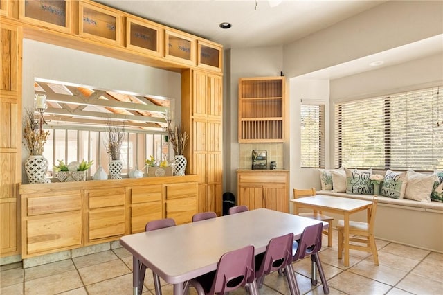 dining space featuring light tile patterned floors and a wealth of natural light