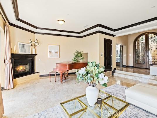 living room with ornamental molding