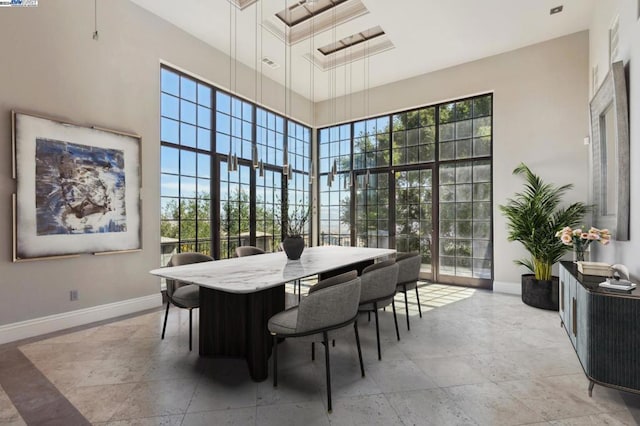 dining area with a high ceiling