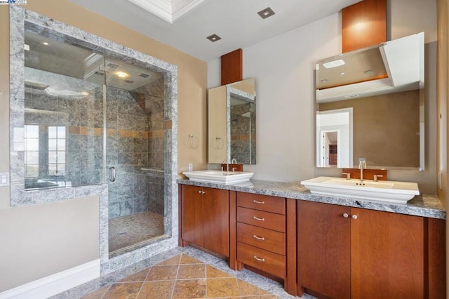 bathroom with vanity, tile patterned floors, and a shower with shower door