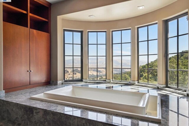 bathroom featuring a mountain view