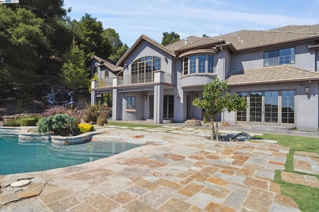 back of house featuring a patio area