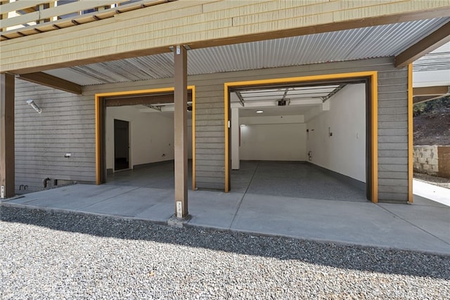 garage featuring wooden walls