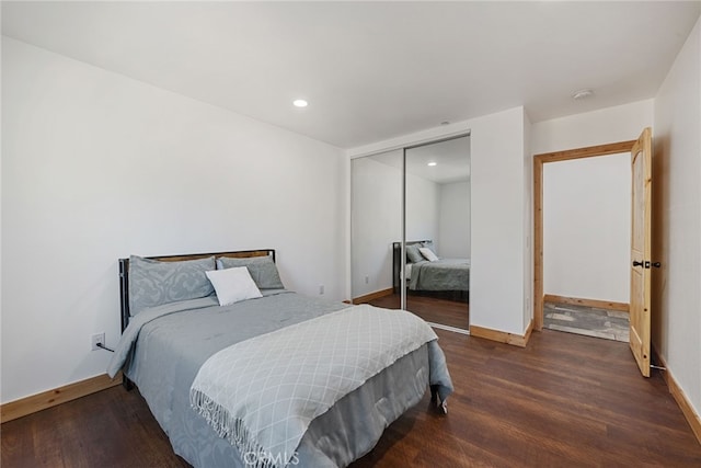 bedroom featuring a closet and dark wood-type flooring