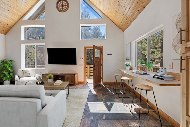 living room with high vaulted ceiling and wooden ceiling