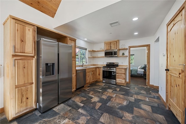 kitchen with appliances with stainless steel finishes and sink