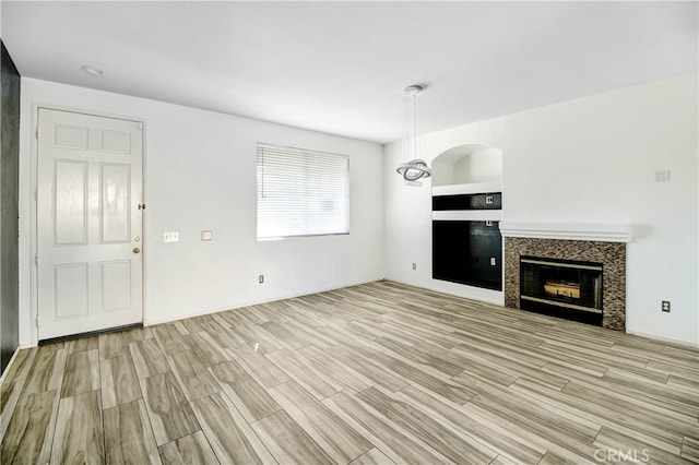 unfurnished living room featuring light wood-type flooring