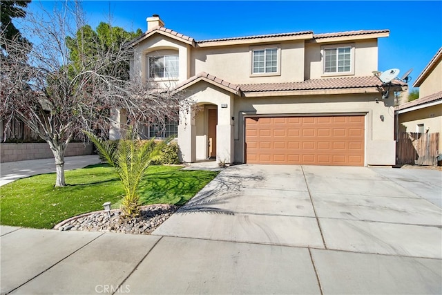 mediterranean / spanish-style house with a garage and a front lawn