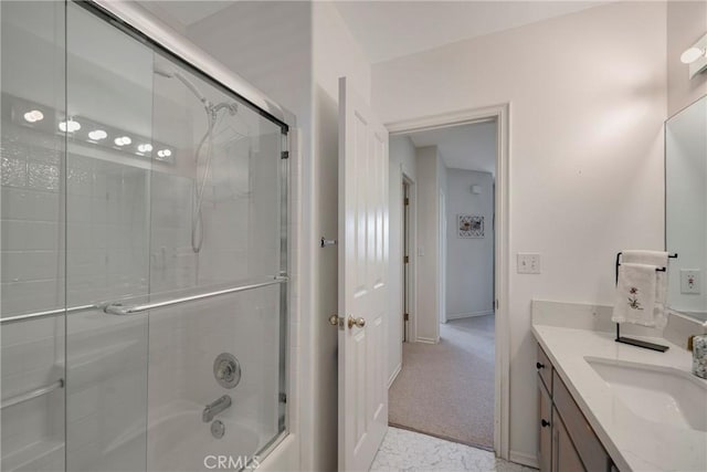 bathroom featuring vanity and bath / shower combo with glass door