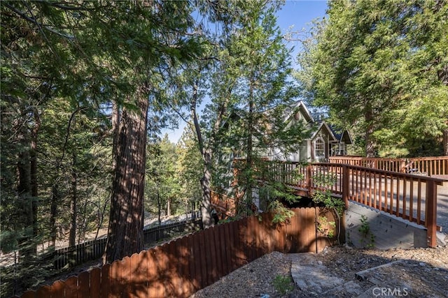 view of yard with a wooden deck