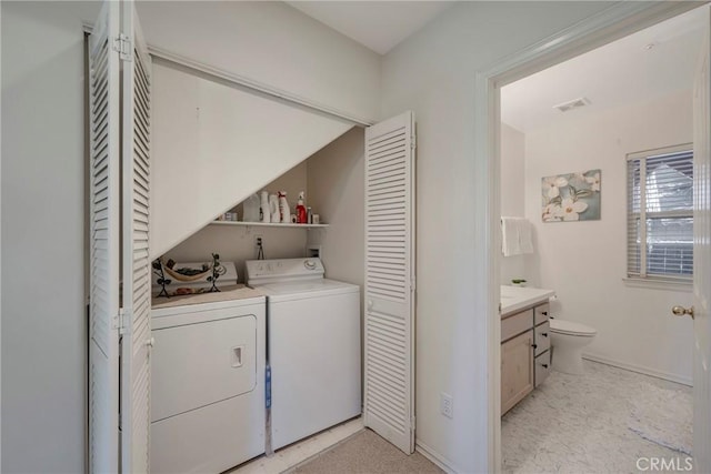 laundry area with washer and clothes dryer