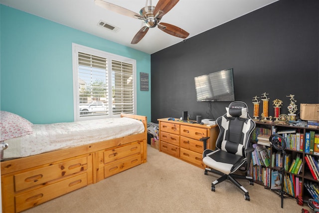 bedroom featuring ceiling fan and light colored carpet