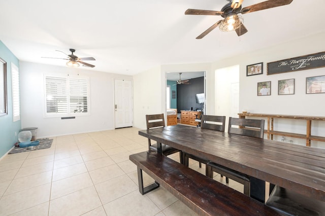 tiled dining area featuring ceiling fan