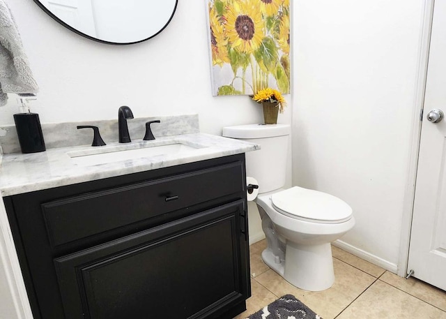 bathroom with tile patterned floors, vanity, and toilet