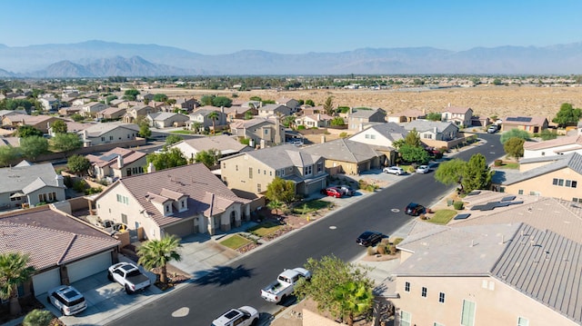 birds eye view of property with a mountain view