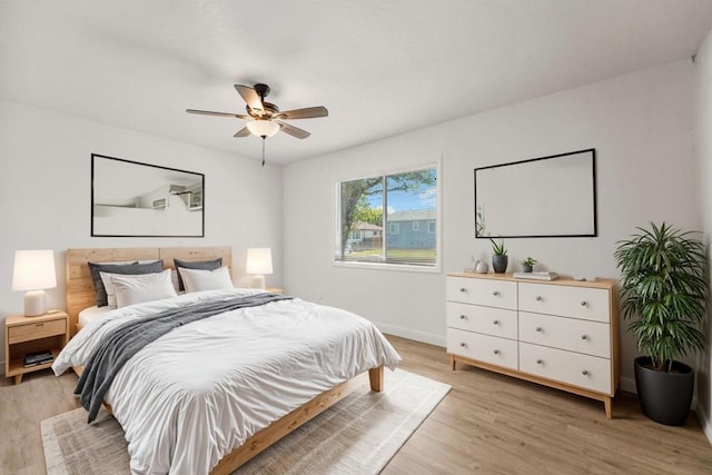 bedroom featuring ceiling fan and light hardwood / wood-style floors