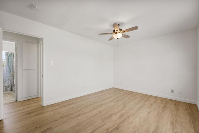 spare room featuring light hardwood / wood-style floors and ceiling fan