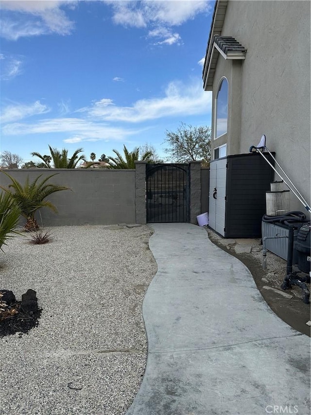 exterior space featuring a gate and fence