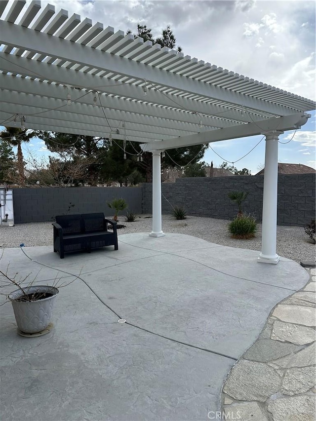 view of patio with a fenced backyard and a pergola