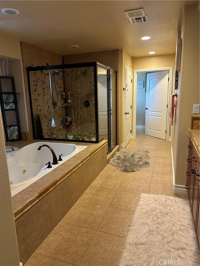 bathroom featuring vanity, visible vents, a shower stall, tile patterned floors, and a tub with jets