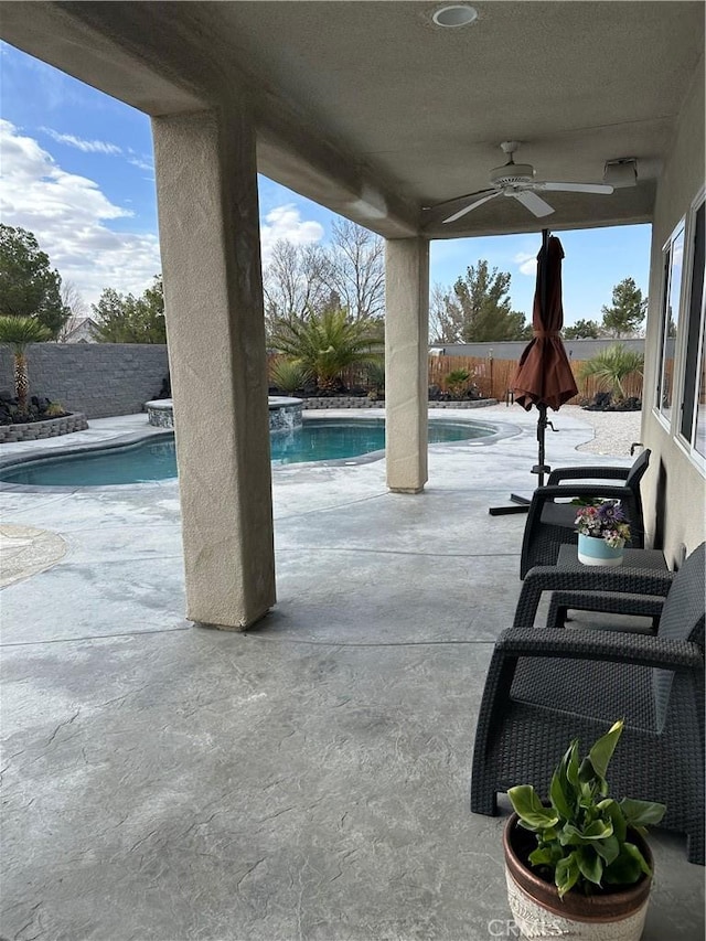 view of patio / terrace featuring a ceiling fan, a fenced in pool, and a fenced backyard