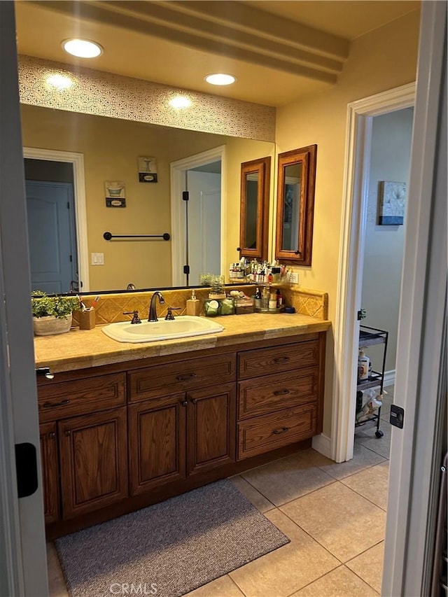 bathroom featuring recessed lighting, vanity, and tile patterned floors