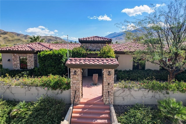 mediterranean / spanish-style home with a mountain view