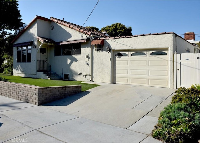 view of side of home featuring a garage