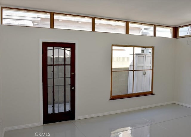 tiled foyer with a healthy amount of sunlight