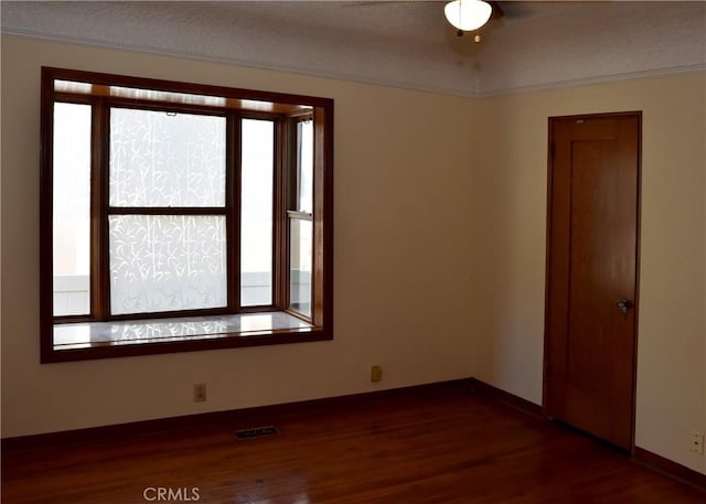 unfurnished room with dark hardwood / wood-style floors