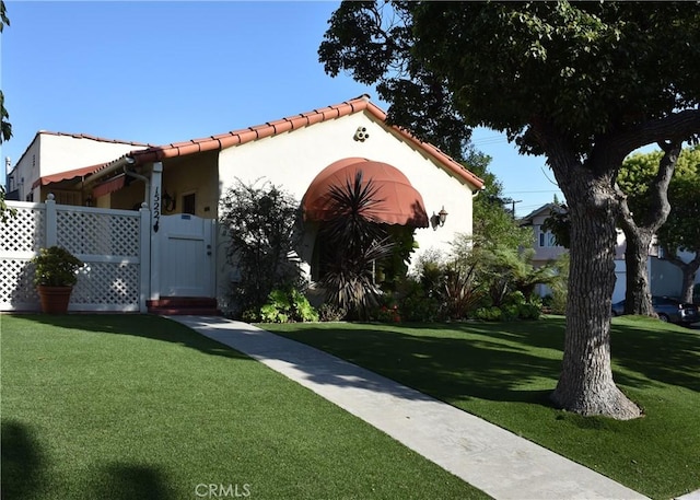 view of side of property with a yard