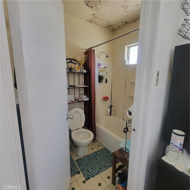 bathroom with shower / bath combo and toilet