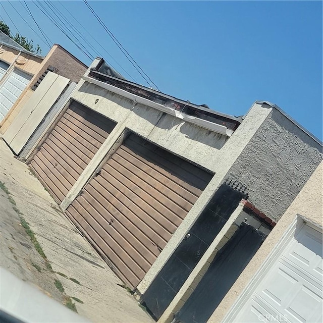 view of side of home with a flat roof