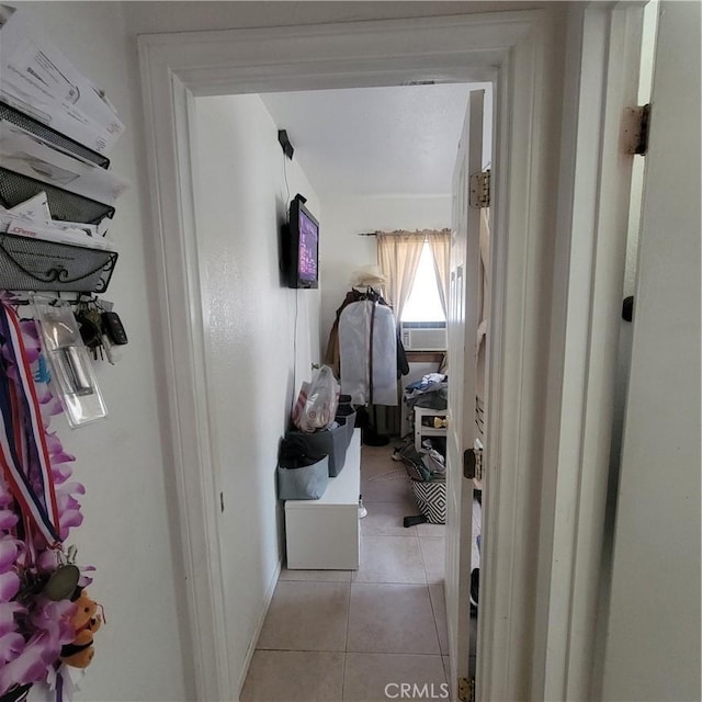 hallway featuring light tile patterned floors