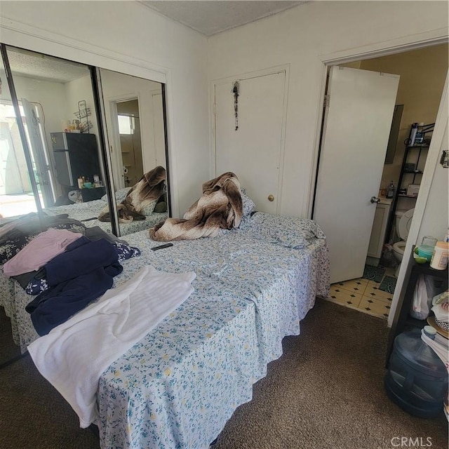 bedroom featuring a closet and multiple windows