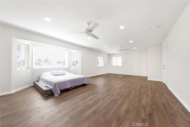 bedroom with ceiling fan and dark wood-type flooring