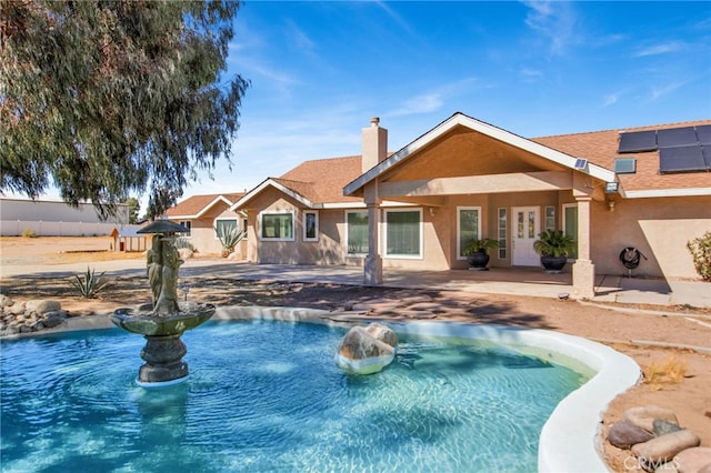 view of pool featuring a patio area