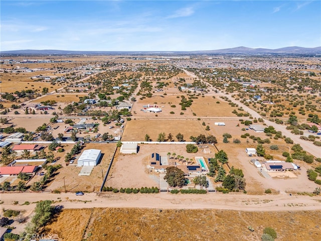 drone / aerial view featuring a mountain view