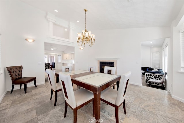 dining space featuring lofted ceiling and a chandelier