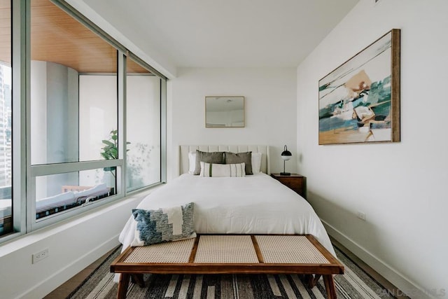 bedroom with hardwood / wood-style floors